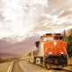 Freight train in Canadian rockies. Wall Mural