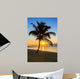 palm tree on a beach at sunset 