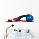 Young fitness woman working her abs with pilates ball Wall Decal