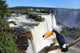 Iguazu Waterfall with a giant toucan bird in foreground Wall Mural