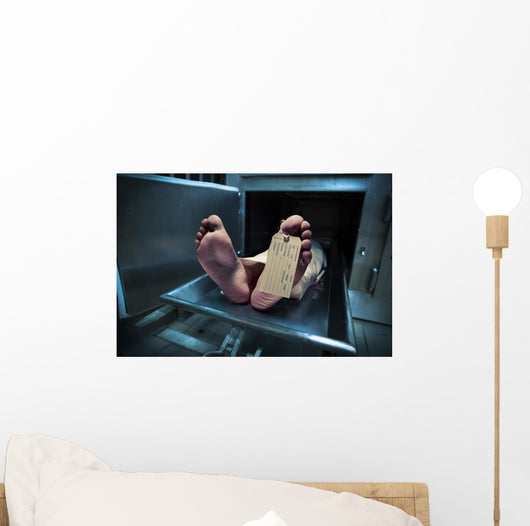 Feet on a morgue table with toe tag with dramatic lighting Wall Mural