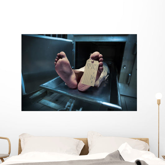 Feet on a morgue table with toe tag with dramatic lighting Wall Mural