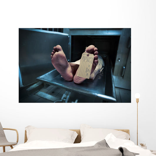 Feet on a morgue table with toe tag with dramatic lighting Wall Mural
