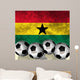 Footballs on top of flag - Ghana Wall Mural