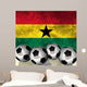 Footballs on top of flag - Ghana Wall Mural