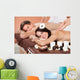Couple Receiving Shoulder Massage At Spa Wall Mural