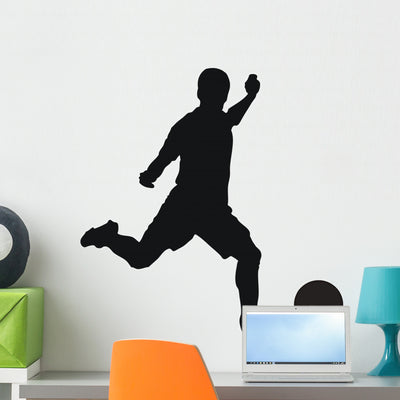 Football shown on a wall