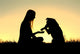 Woman and Her Dog Shaking Hands Silhouette Wall Mural