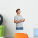Asian man reading a book looking up with day dreaming Wall Decal