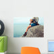 Young Woman Sitting Rock Wall Mural