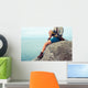Young Woman Sitting Rock Wall Mural
