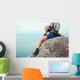 Young Woman Sitting Rock Wall Mural