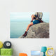 Young Woman Sitting Rock Wall Mural