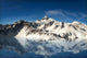 Majestic snow covered mountains reflecting in the water Wall Mural