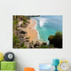 beautiful beach where people are surfing in water Wall Mural