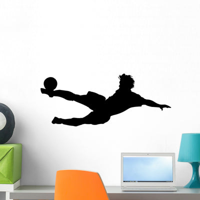 Acrobatic Kicking Soccer Player Wall Decal shown on a wall
