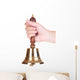 Gold retro school bell in hand isolated on white Wall Decal