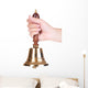 Gold retro school bell in hand isolated on white Wall Decal