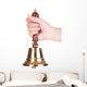 Gold retro school bell in hand isolated on white Wall Decal