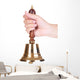 Gold retro school bell in hand isolated on white Wall Decal