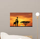 baby giraffe silhouette at sunset Wall Mural