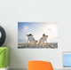 romantic couple on deckchair relaxing on the beach Wall Mural