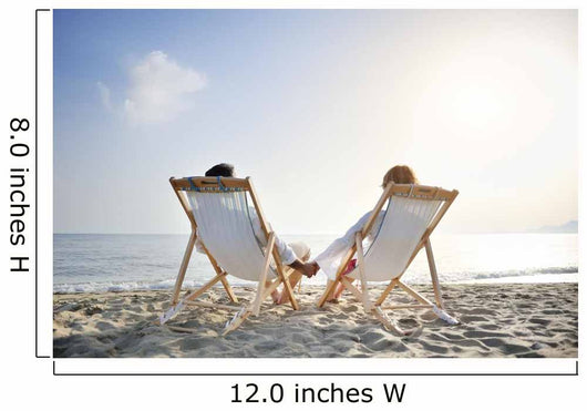romantic couple on deckchair relaxing on the beach Wall Mural