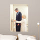 General practitioner measuring male patient's height in hospital Wall Mural