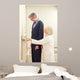 General practitioner measuring male patient's height in hospital Wall Mural