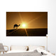Silhouette of a camel walking alone in the Dubai desert Wall Mural