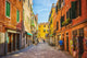 Narrow Canal among Old