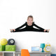 Pretty little girl performs gymnastic exercise Wall Decal