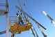 Steel Worker on cherry picker Wall Mural
