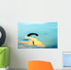 unidentified skydiver, parachutist on blue sky Wall Mural