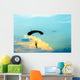 unidentified skydiver, parachutist on blue sky Wall Mural