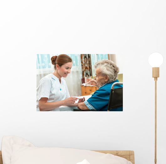 Female Nurse Giving Senior Wall Decal