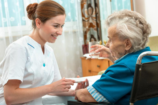 Female Nurse Giving Senior Wall Decal