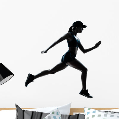 Woman Runner Jogger Silhouette Wall Decal shown on a wall