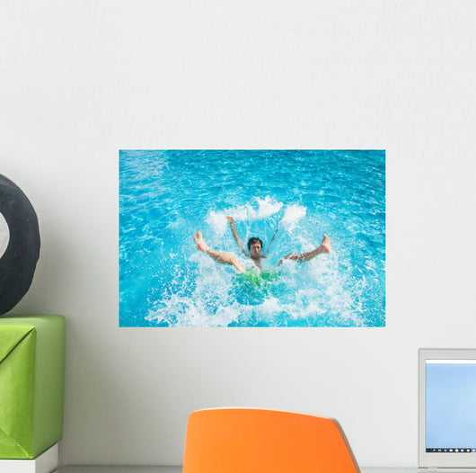 Man falling and splashing into water Wall Mural