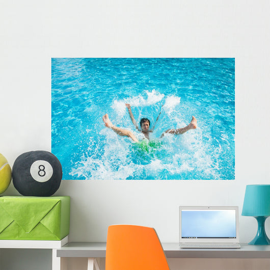 Man falling and splashing into water Wall Mural