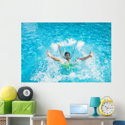 Man falling and splashing into water Wall Mural