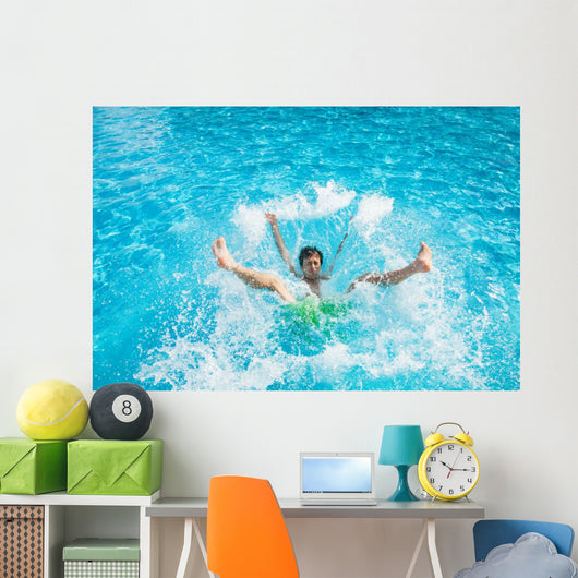 Man falling and splashing into water Wall Mural