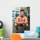 Shirtless Muscular Man Flexing Muscles in Gym Wall Mural