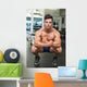 Shirtless Muscular Man Flexing Muscles in Gym Wall Mural