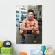 Shirtless Muscular Man Flexing Muscles in Gym Wall Mural