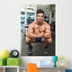 Shirtless Muscular Man Flexing Muscles in Gym Wall Mural