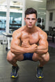 Shirtless Muscular Man Flexing Muscles in Gym Wall Mural