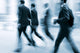 motion blurred business people walking on the street Wall Mural