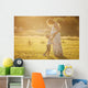 Small boy kissing belly of his pregnant mother outdoors Wall Mural