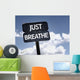 Just Breathe sign with clouds and sky background Wall Mural
